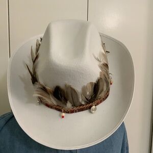 Feather headband on braided tan band with accents